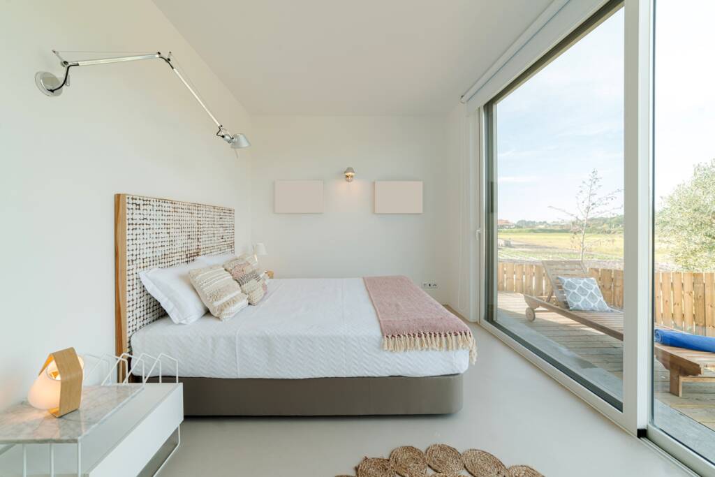 Bedroom suite in modern villa with pool and deck