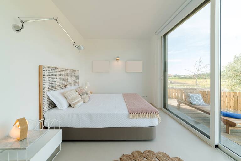 Bedroom suite in modern villa with pool and deck
