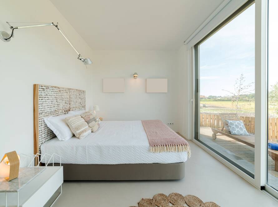 Bedroom suite in modern villa with pool and deck