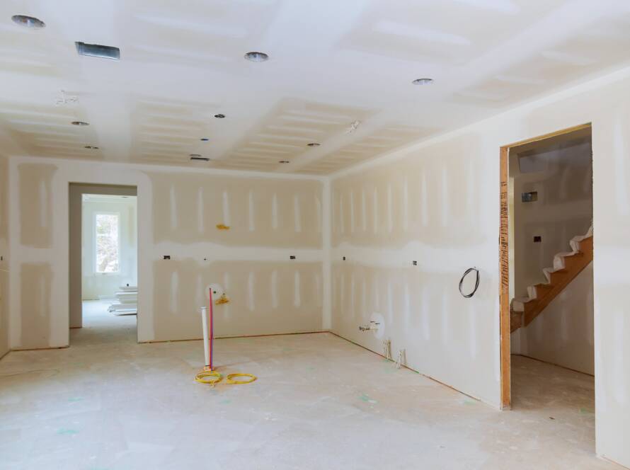 Drywall is hung in kitchen remodeling project Interior of apartment with materials during on the