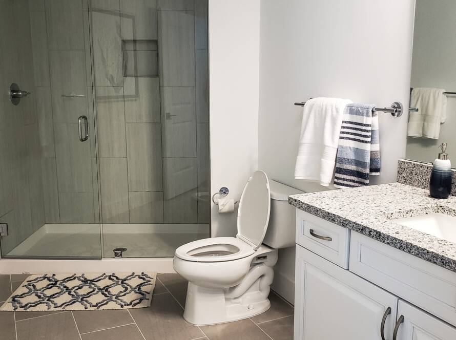 Recent home improvements remodeling a bathroom in white with neutral colors.