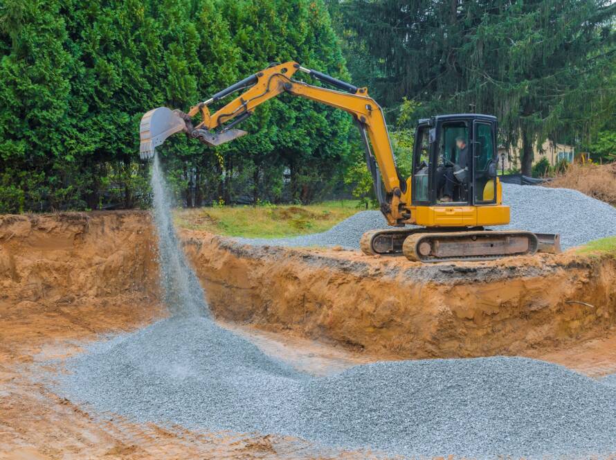 To serve as a foundation for a concrete structure, excavators fill irregularities in excavations